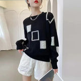 Adorelle - Künstlerischer Strickpullover im Patchwork-Design – Schwarz