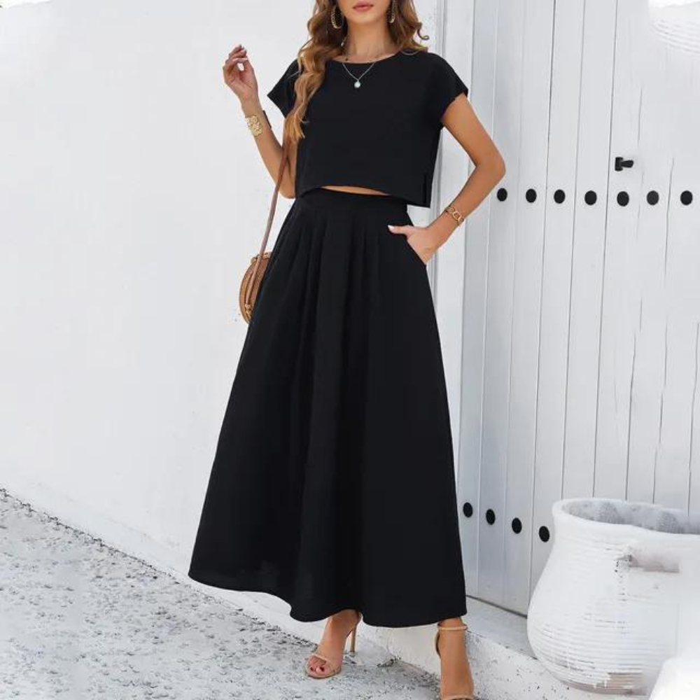 Elegantes Outfit mit Crop Top und langem fließendem Rock, perfekt für einen raffinierten und modernen Look, ideal für besondere Abende