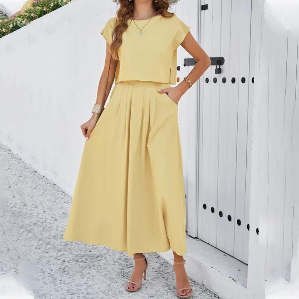Elegantes Outfit mit Crop Top und langem fließendem Rock, perfekt für einen raffinierten und modernen Look, ideal für besondere Abende