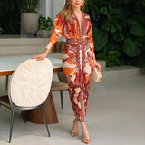 V Ausschnitt Kleid Damen | Figurbetonter Schnitt & Ornamentales Print-Design – Orange