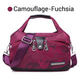 Oella | Diebstahlsichere Handtasche mit 10 Fächern – Camouflage Fuchsia
