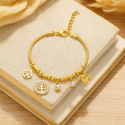 Elegantes goldenes Edelstahlarmband – Hohler Baumanhänger mit synthetischen Zirkonia-Charms