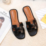 Damen Ledersandalen Soleil | Flache Sandalen mit H-Riemen – Schwarz
