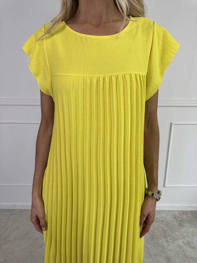 VALE | Nancy – The Long Pleated Dress with Ruffle Sleeves
