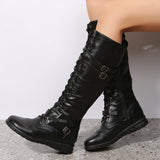 Damen nan kniehohe Military‑inspirierte Schnürstiefel mit seitlichem Reißverschluss verstellbaren Ziergurten und stoßdämpfender Profilsohle Drune – Schwarz