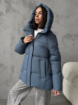 Damen Oversized Steppjacke mit Kapuze und integrierten Taschen – Blau
