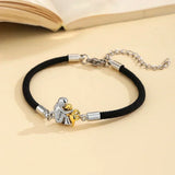 KATY | ARMBAND MIT HUNDESYMBOL – Schwarz