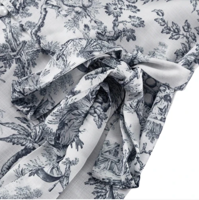 Elegantes Sommerkleid mit Puffärmeln & Plisseerock