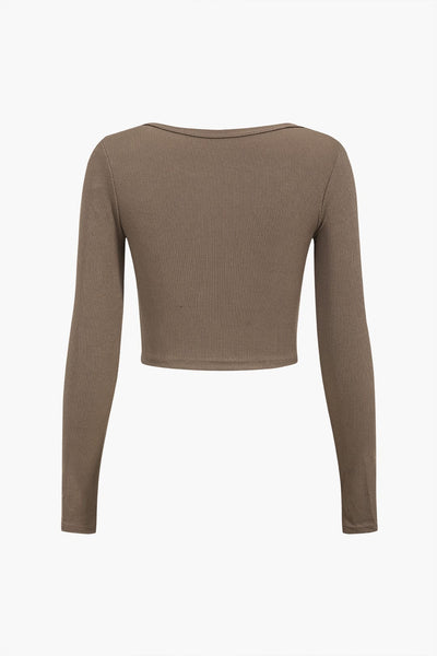 Amira | Asymmetrisches Langarm-Top mit Cut-Out & Knopfdetails