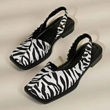 Flache Damenschuhe mit eckiger Spitze und Fersenriemen | Veganes Leder – Zebra